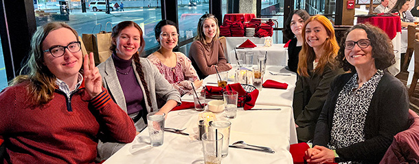 Image of Patty Tarantello at a restaurant with students.