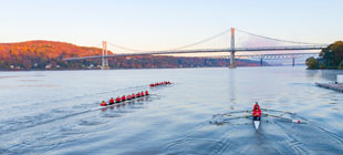 Image of crew shells rowing on the Hudson River.