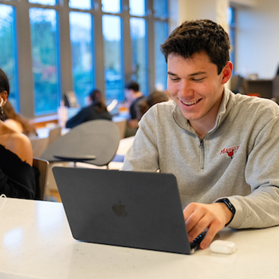 image of student with lap top